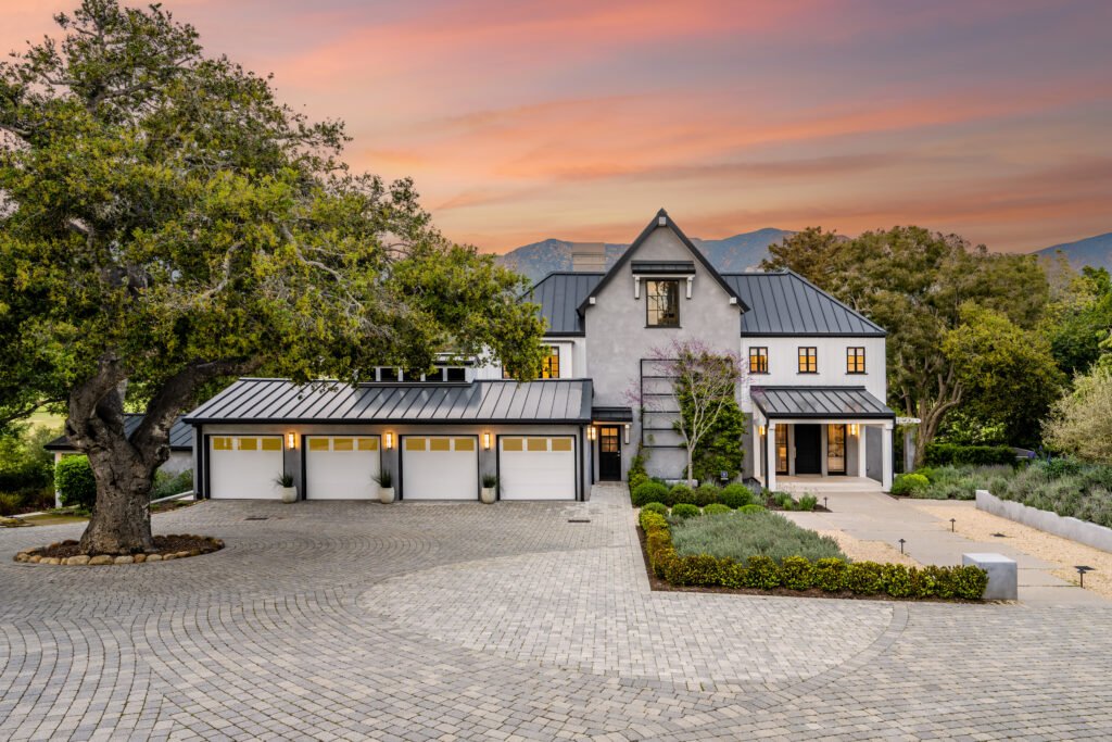 Spacious hilltop estate with tree and driveway
